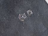 a pair of earrings that have been left on a piece of cloth