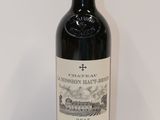 a bottle of wine that is sitting on a table