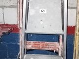 an image of a set of ladders in a garage