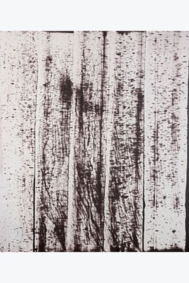 a black and white photo of a wood wall