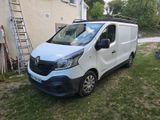 a white van that is parked in the grass