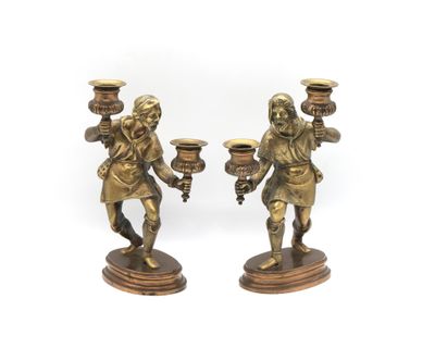 pair of antique brass figurines of a man and a woman