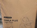 cardboard box of a baby high chair in a store