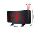 an alarm clock with a red light on top of it