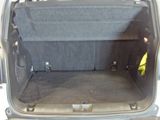 a trunk of a car with the back seats folded down
