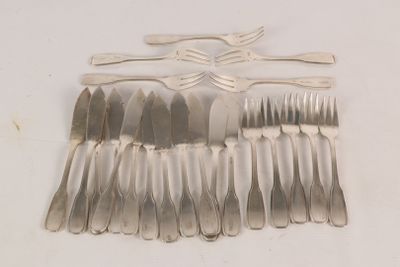 a lot of forks and spoons laid out on the table