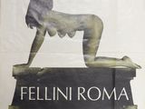 the poster for the film fellini roma is hanging on the wall