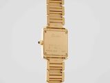 a close up of a gold wrist watch on a white background