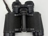a close up of a pair of binoculars on a white surface
