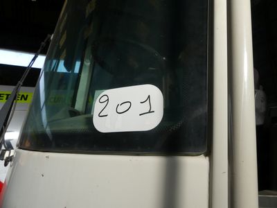 a white bus with a number on the side of it