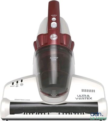 a red and silver vacuum that is on top of a white table