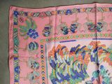 a pink scarf with a picture of a rooster on it