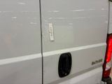 a close up of a white van with the door open