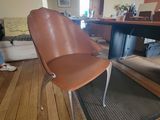 a chair that is sitting in the middle of a living room