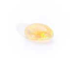 a yellow oplite stone on a white background