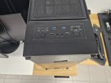 a computer sitting on top of a desk next to a monitor