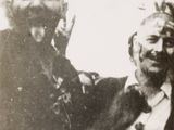 an old photo of a man and a woman sitting together