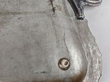 a silver tray with a handle on it on a table