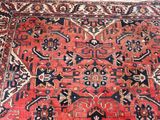 an image of a large oriental rug on a wooden floor