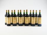 a group of six bottles of wine sitting next to each other