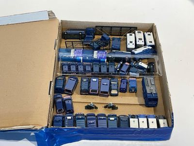 a lot of cell phones in a box on a table
