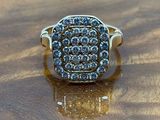 a close up of a ring on a wooden surface