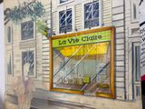 a drawing of a storefront on the side of a building