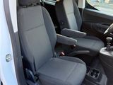 two seats in the back of a van with the door open