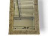 a square mirror with a window in the middle of it