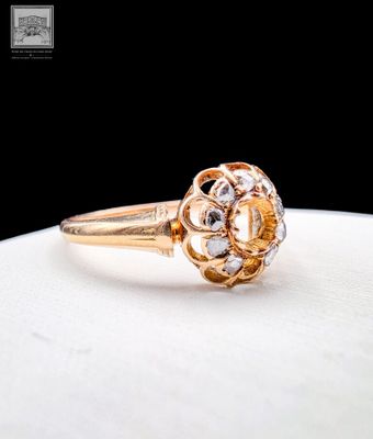 an image of a gold ring with a rose cut diamond