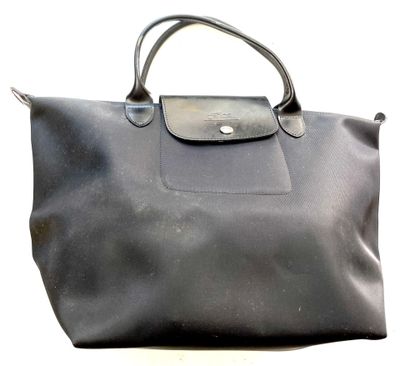 black longchamp bag on a white background