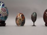 several different types of vases are lined up on a white surface