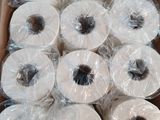 many rolls of toilet paper in a box on the floor
