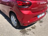 a red car that is parked in a parking lot