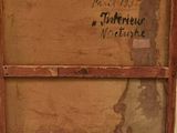 an old wooden box with writing on it sitting on a table