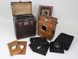 many different types of antique cameras on display