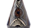a black and white vase with a design on it