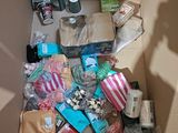 a cardboard box filled with items and a shadow of a person