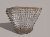 a glass vase that is sitting on a table