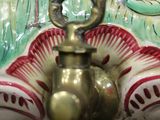 a close up of a faucet with a bird on it