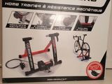 a box with a bike trainer and a bicycle on it