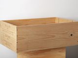 a wooden box that is sitting on top of a table