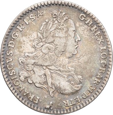 une pièce d'argent portant une tête de femme