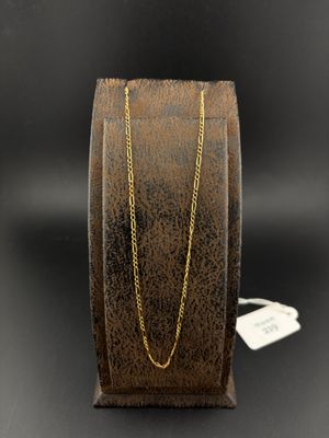 a close up of a bracelet with a gold chain on it
