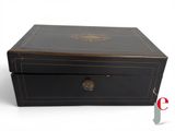 an image of a black box with a gold emblem on the lid