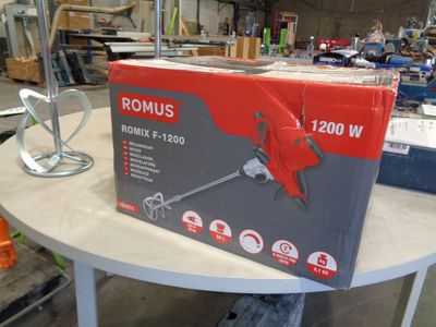 a box of tools sitting on a table in a workshop