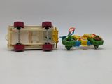 a toy car and a toy motorcycle on a white surface