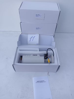 a white box with a bottle of water inside of it