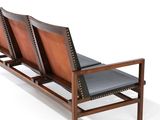 a wooden bench with two leather seats on it
