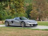a silver sports car parked on the side of the road
